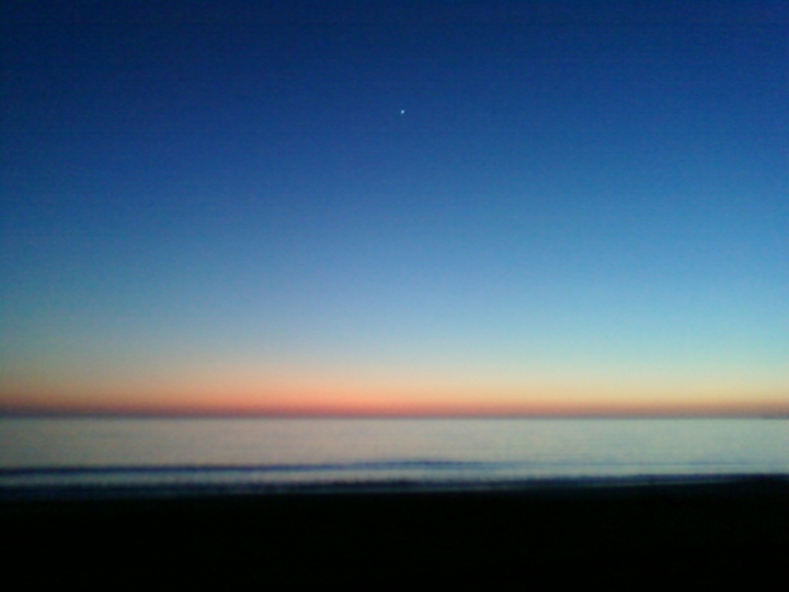 Image or picture of Venus as an evening star over the Monterey Bay.